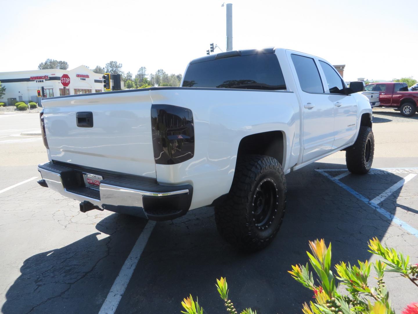 2018 White /BLACK Chevrolet Silverado 1500 LT (3GCPCREC7JG) with an 5.3L V8 OHV 16V engine, automatic transmission, located at 2630 Grass Valley Highway, Auburn, CA, 95603, (530) 508-5100, 38.937893, -121.095482 - Must see Pre Runner.... CST front lift spindals, Camburg UCA's, King Adjustable 2.5 Coil-overs, King 2.5 rear shocks, 35" Toyo RT Trail tires, 17" Method Race wheels, MZ front skid plate, G2 rear differntail cover, Full size bed mounted spare tire, Black Vinyl roof wrap, smoke tail lights and 3rd br - Photo#4